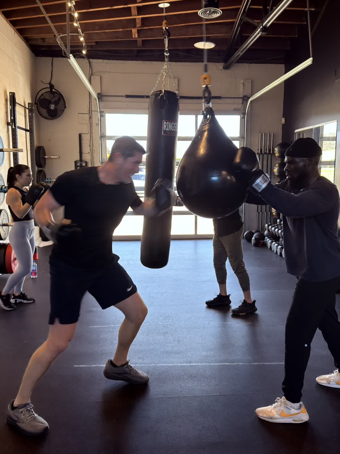 Members working the heavy bags