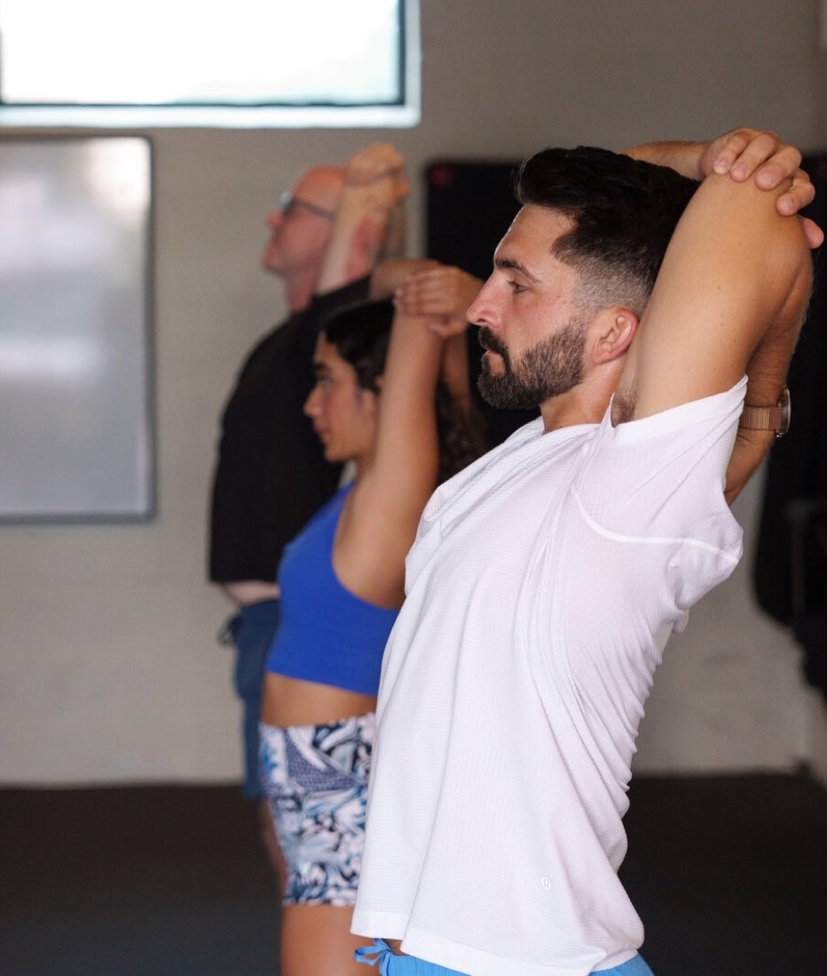 Class reaching through an overhead stretch